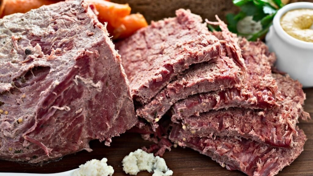 Sliced corned beef served with horseradish